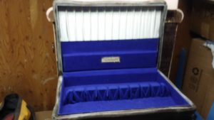 Blue velvet interior of white goldware dining ware box 