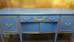 1950's credenza, paint is rainbow blue with gold accents, with a satin finish. Boho shabby chic. 