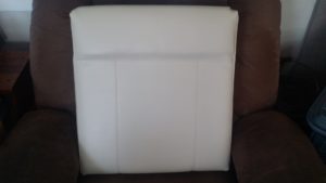 After picture of the above boat seat reupholstered in white vinyl. 