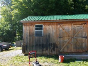 Before picture of our latest restoration jobs, there are two 12 x 24 Amish built sheds, they will be stained with a redwood stain. The contrast with the green tin roof. It will look sharp when done.