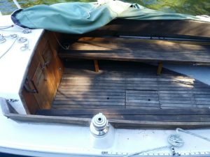 Inside Teak wood. compartment of the Pearson Ensign sailboat. It will be restored to a honey teak color. 